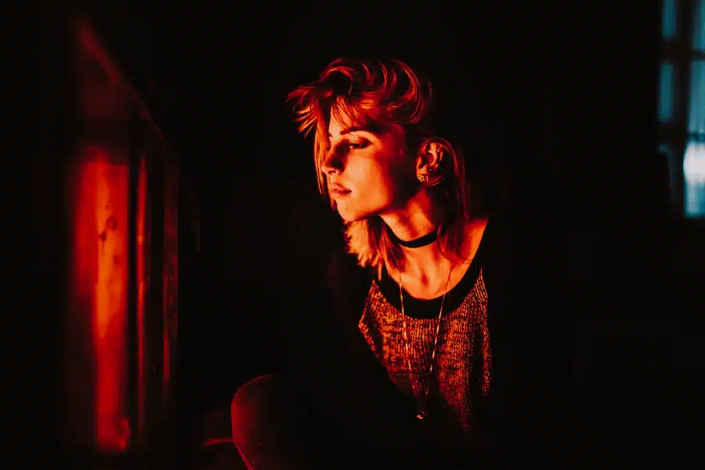 Profile View of Woman in Red Light