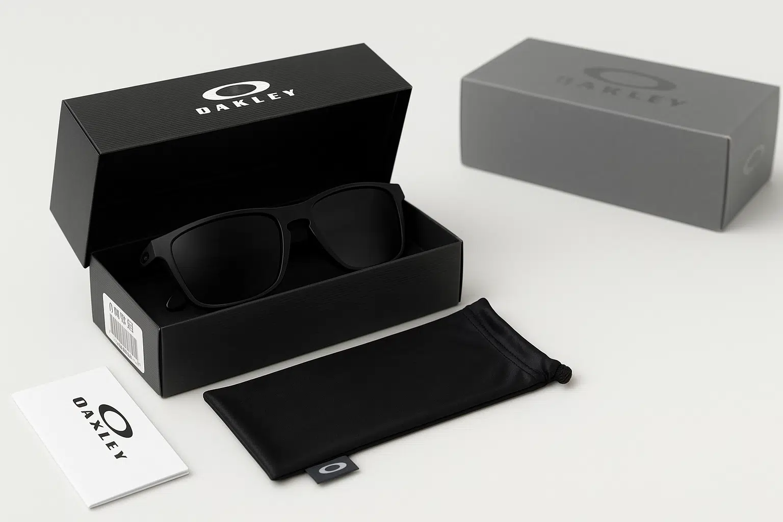 Genuine Oakley sunglasses packaging with original box, cleaning pouch, warranty card, and visible SKU label